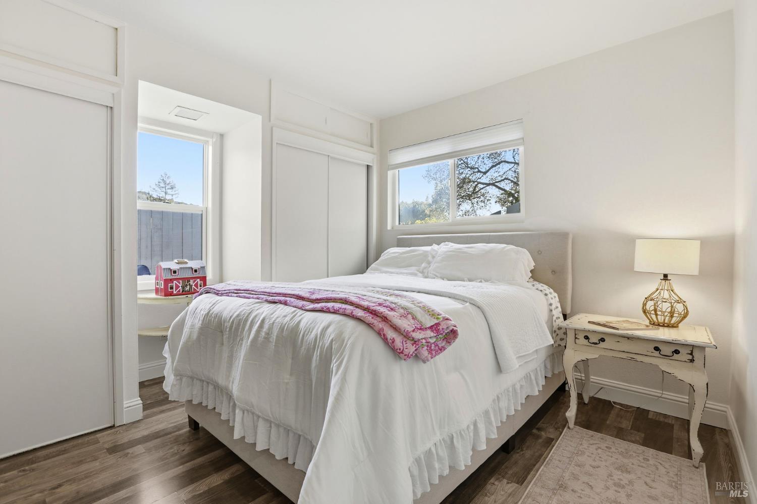 280 Prospect Drive San Rafael, CA 94901 - Photo 15 of 38 a bedroom with a bed and wooden floor