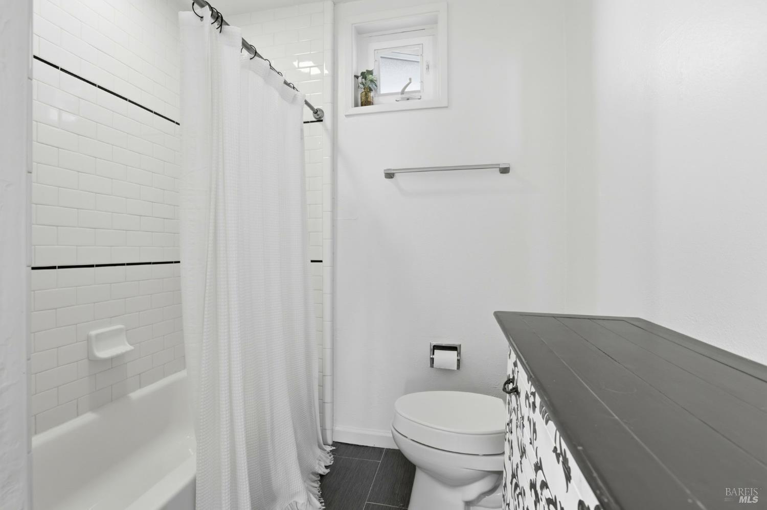 280 Prospect Drive San Rafael, CA 94901 - Photo 17 of 38 a bathroom with a granite countertop toilet and a shower