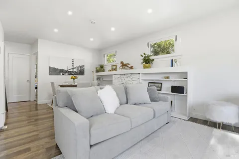 a kitchen with a refrigerator a sink and a stove top oven
