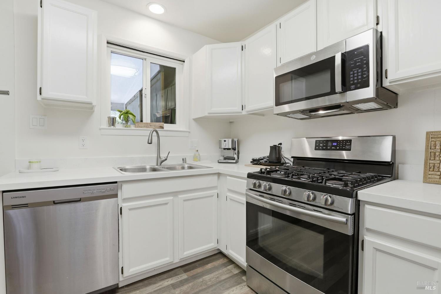 280 Prospect Drive San Rafael, CA 94901 - Photo 8 of 38 a kitchen with stainless steel appliances granite countertop a sink dishwasher a stove microwave and oven with cabinets