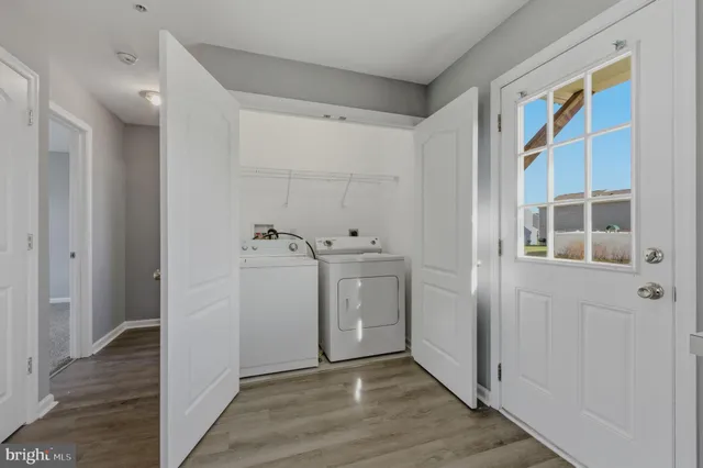 a view of a storage & utility room with washer and dryer