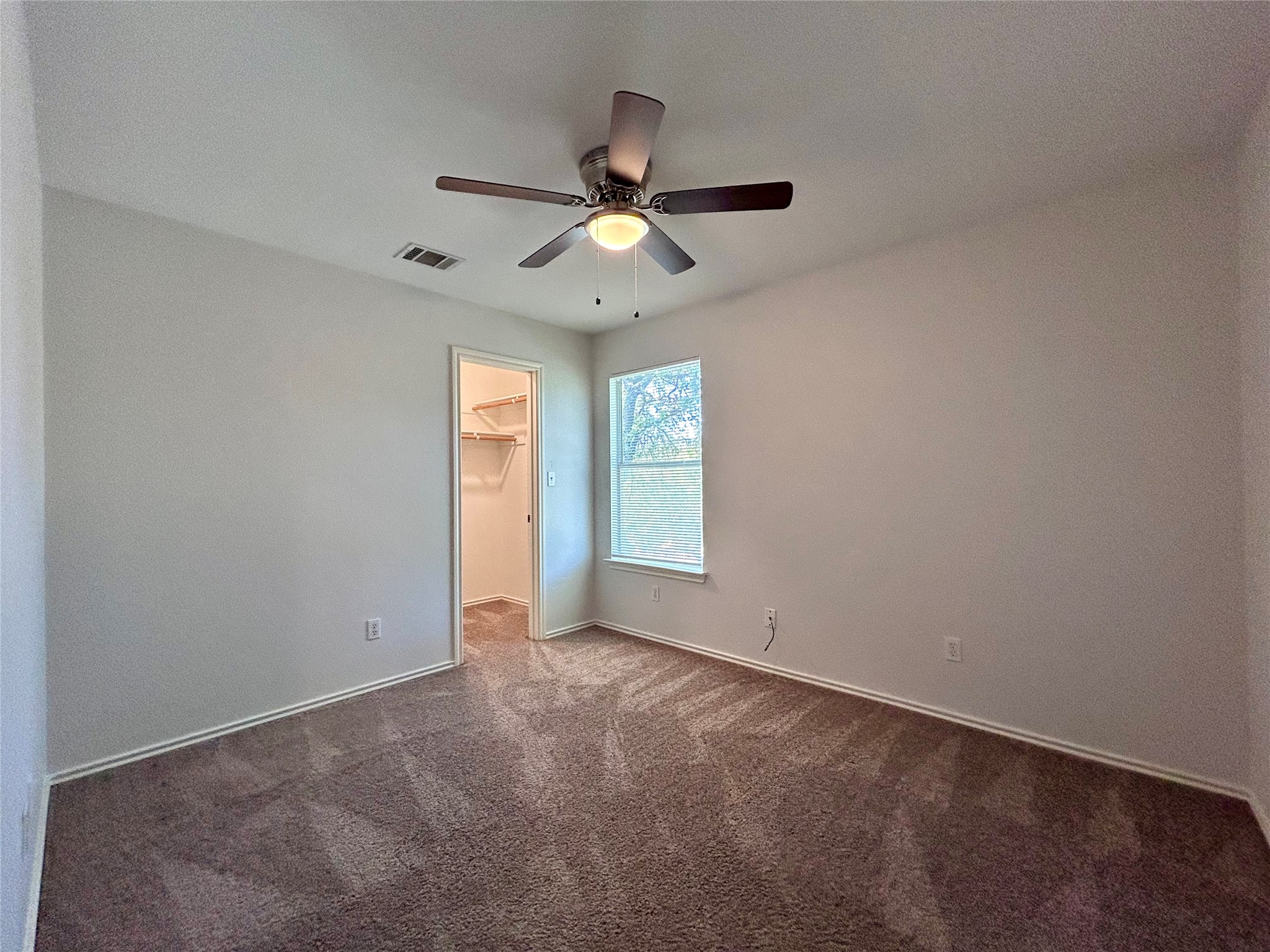 12307 Abney Drive Austin, TX 78729 - Photo 10 of 18 an empty room with closet and windows