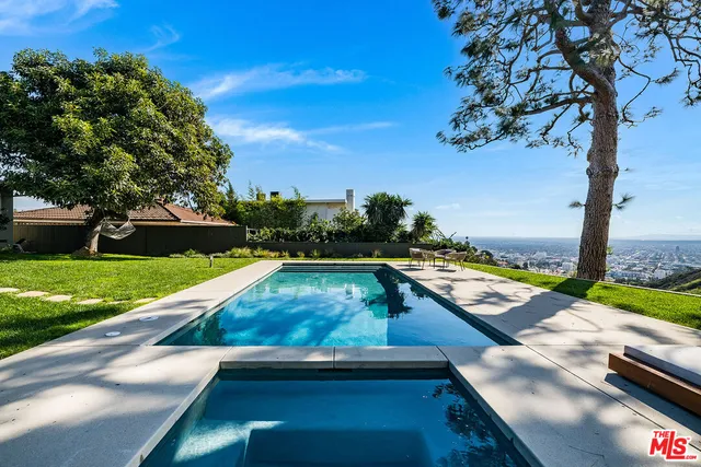 a view of swimming pool with lounge chair
