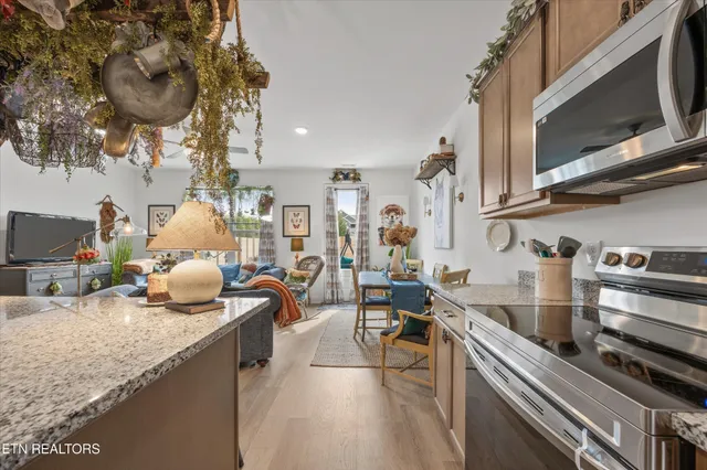 a kitchen with sink stove and cabinets