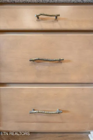 a view of kitchen with sink and natural light