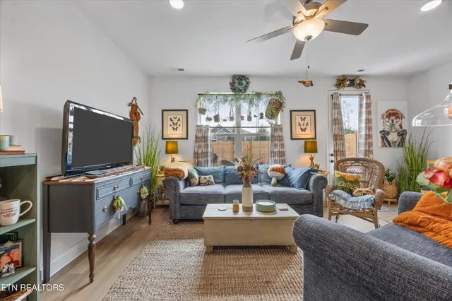 a living room with furniture and a flat screen tv