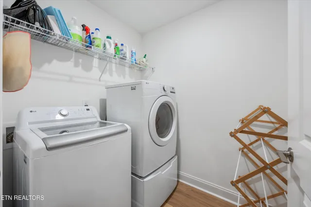 a spacious bedroom with a bed and a chandelier