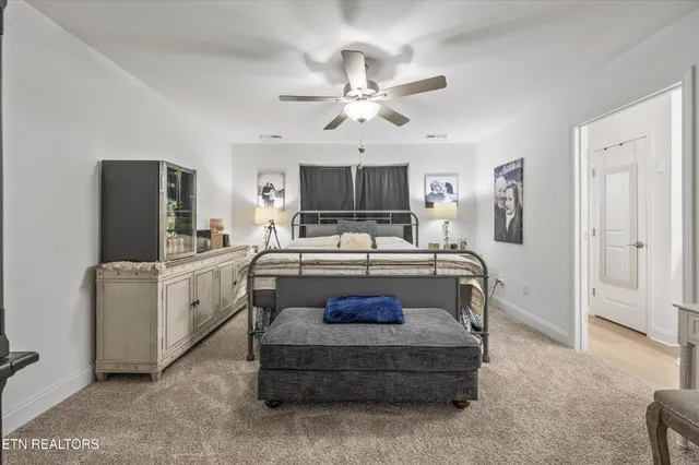 a bathroom with a granite countertop sink a mirror and a shower