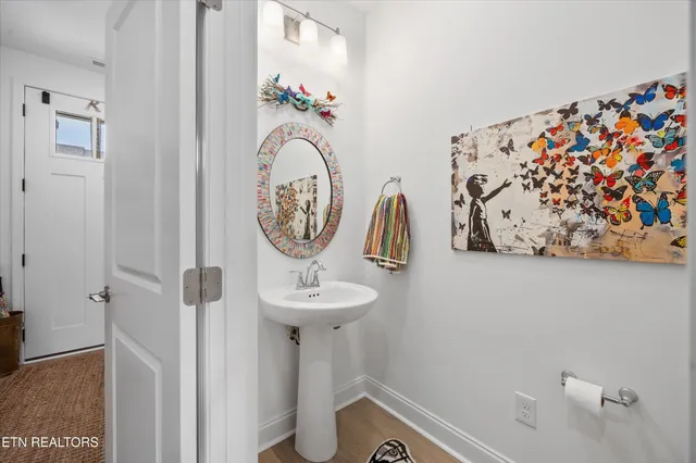 a view of a hallway with paintings on the wall