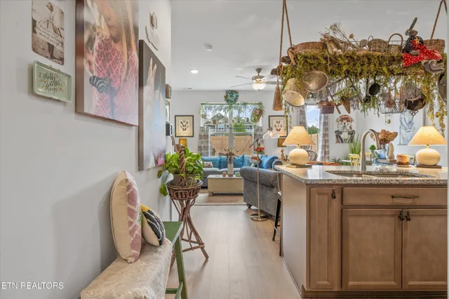 a dining room with furniture and flowers
