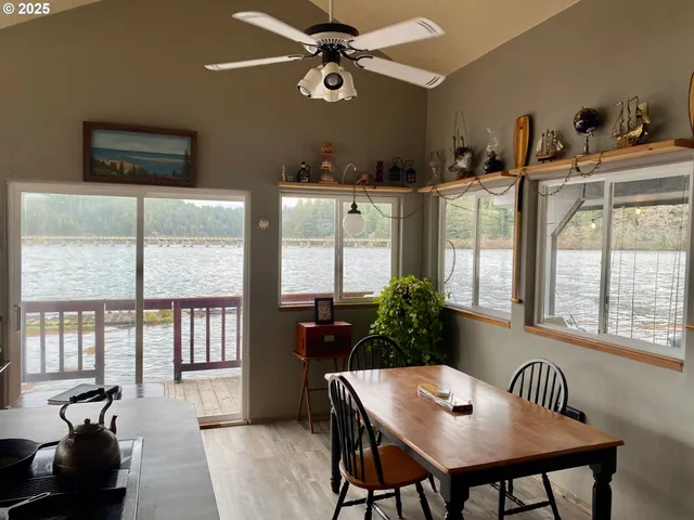 a view of a dining room with furniture window and outside view