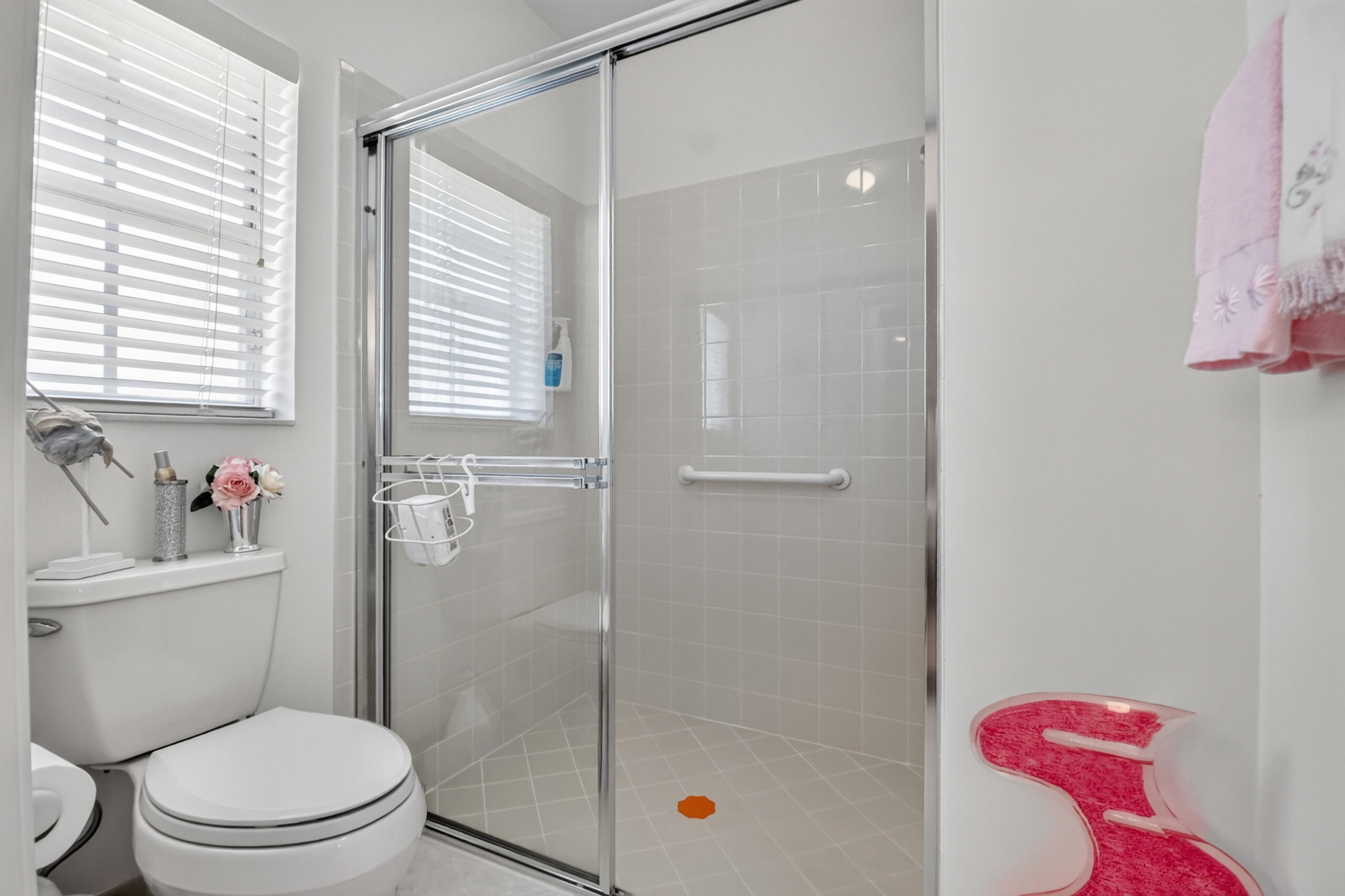 15340 Floral Club Road Delray Beach, FL 33484 - Photo 26 of 42 a white toilet sitting next to a bathroom sink