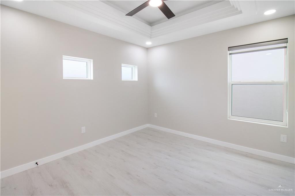 2202 Corales Street Mission, TX 78573 - Photo 11 of 18 Spare room featuring light wood-type flooring, ceiling fan, and recessed lighting