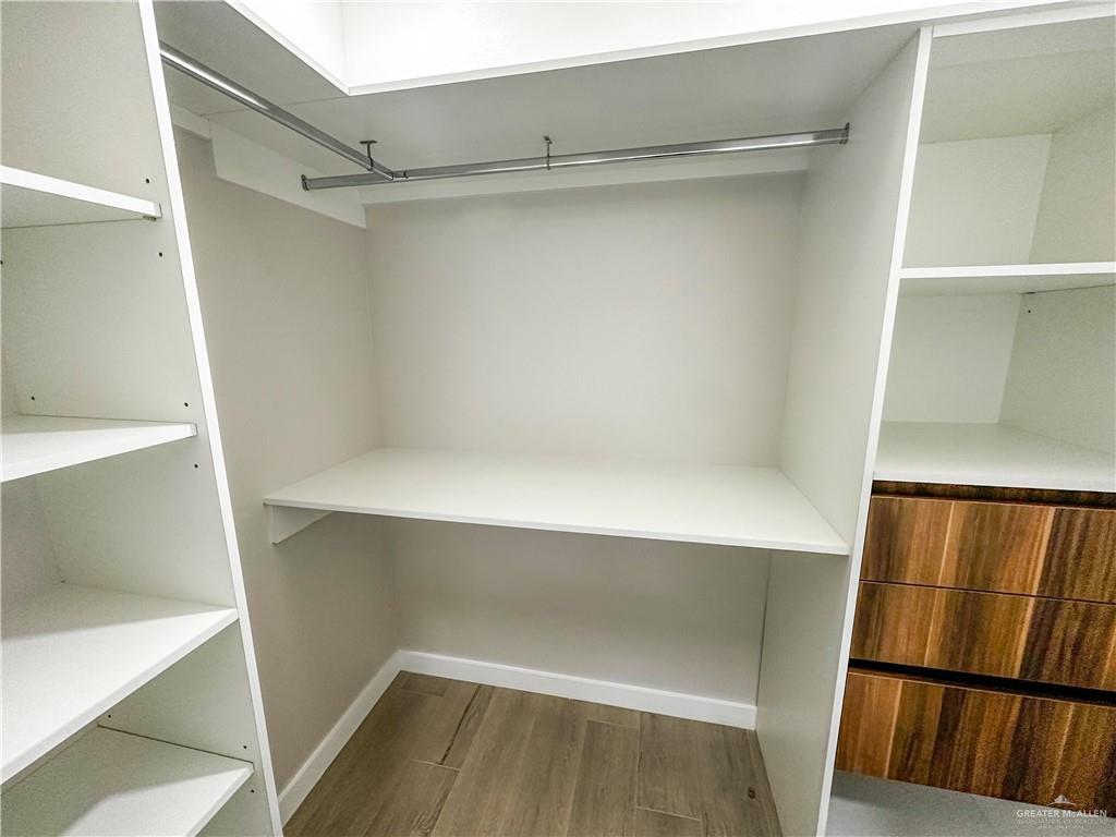 2202 Corales Street Mission, TX 78573 - Photo 5 of 18 Walk in closet featuring wood finished floors