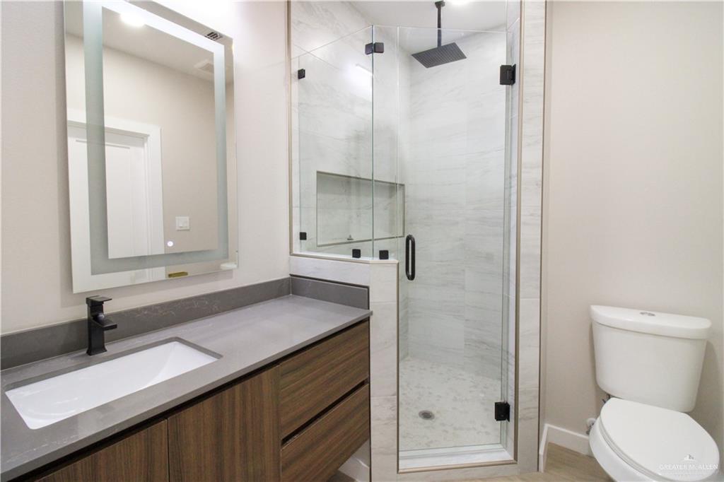 2202 Corales Street Mission, TX 78573 - Photo 7 of 18 Full bathroom with a shower stall and vanity