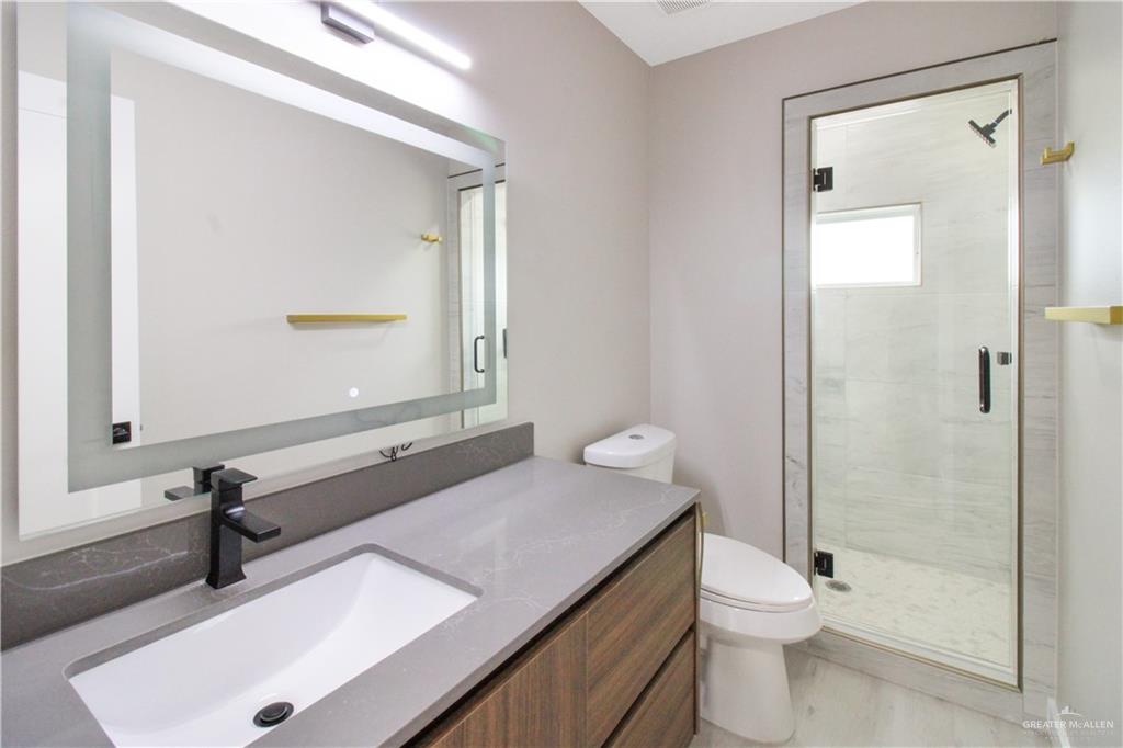 2202 Corales Street Mission, TX 78573 - Photo 10 of 18 Full bathroom featuring vanity and a stall shower