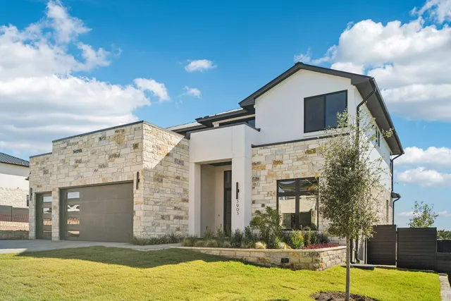 a view of a house with swimming pool and a yard