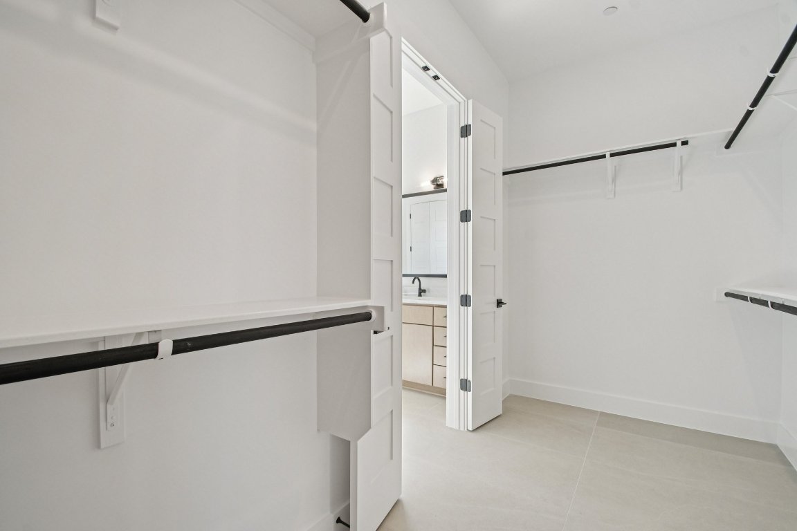 5903 Moondust Lane Austin, TX 78730 - Photo 19 of 37 a bathroom with a shower and a glass door