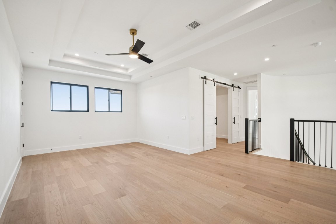 5903 Moondust Lane Austin, TX 78730 - Photo 24 of 37 a view of empty room with wooden floor and fan