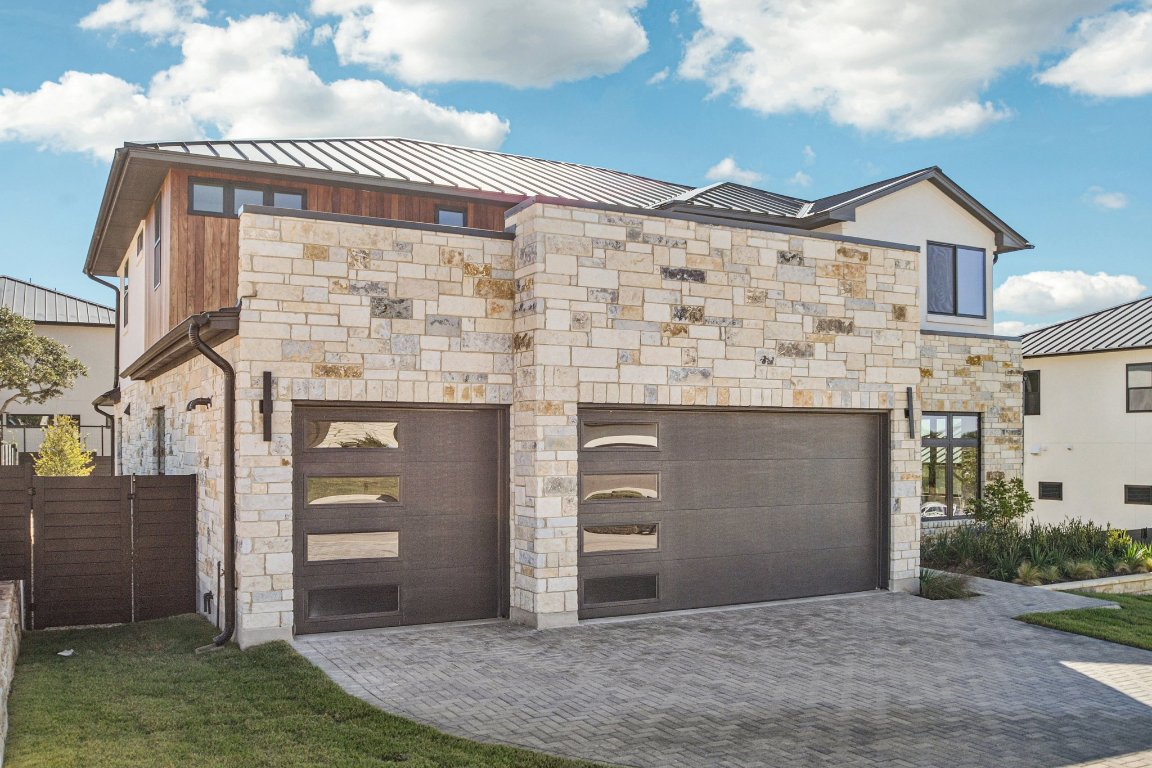 5903 Moondust Lane Austin, TX 78730 - Photo 3 of 37 a front view of a house with a yard