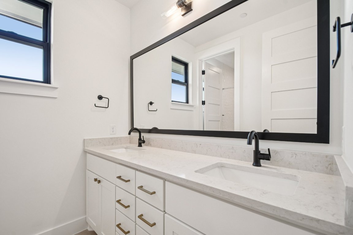 5903 Moondust Lane Austin, TX 78730 - Photo 31 of 37 a bathroom with a sink and a mirror