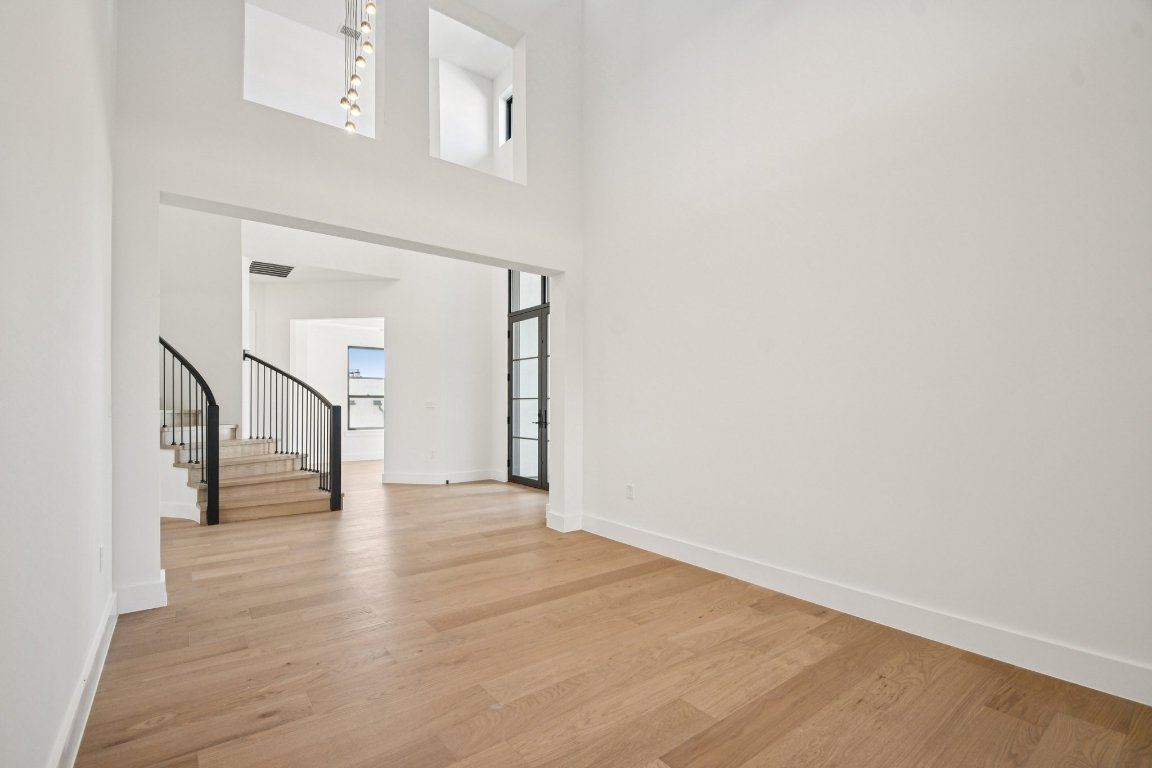 5903 Moondust Lane Austin, TX 78730 - Photo 4 of 37 a view of an empty room with wooden floor