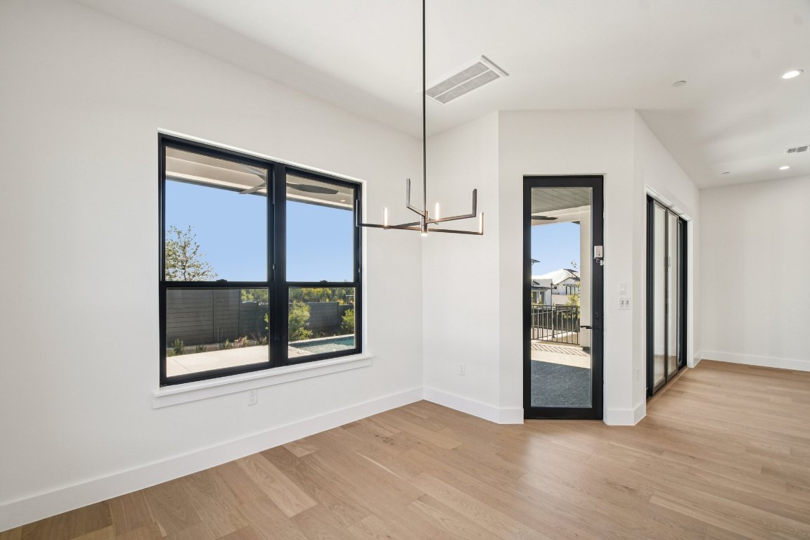 5903 Moondust Lane Austin, TX 78730 - Photo 10 of 37 a view of an empty room with glass door and a window
