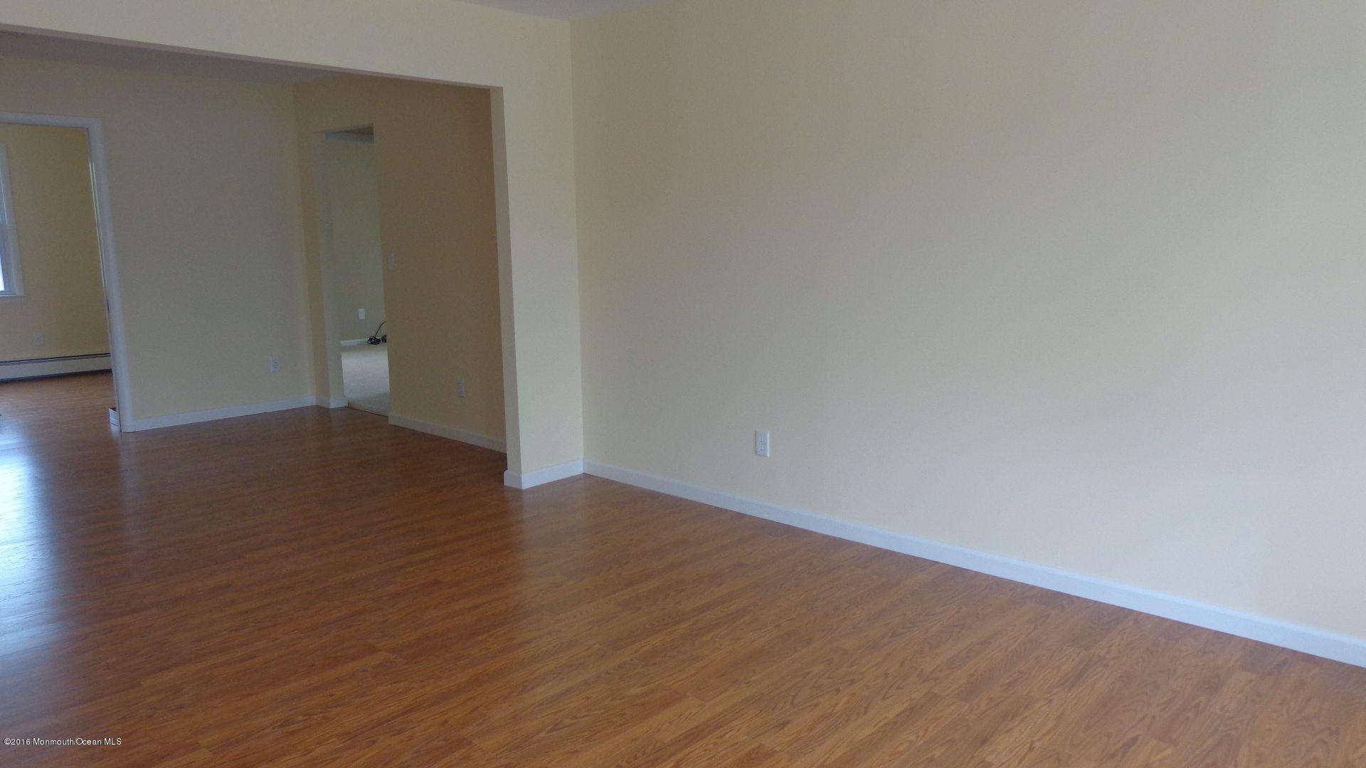 4 Garrett Road Toms River, NJ 08757 - Photo 3 of 19 a view of an empty room with wooden floor