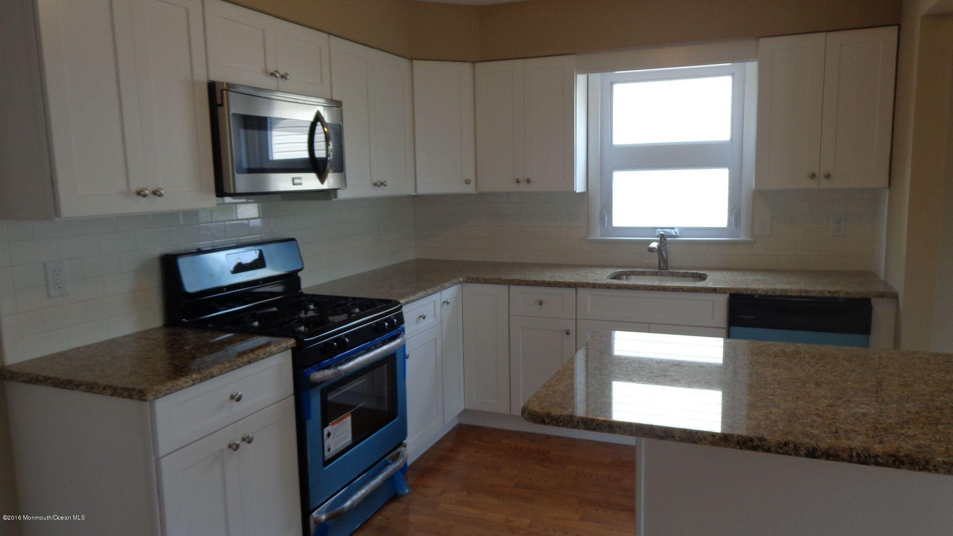 4 Garrett Road Toms River, NJ 08757 - Photo 6 of 19 a kitchen with granite countertop cabinets stainless steel appliances a sink and a window
