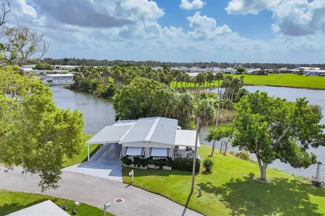 a view of a lake with houses in the back