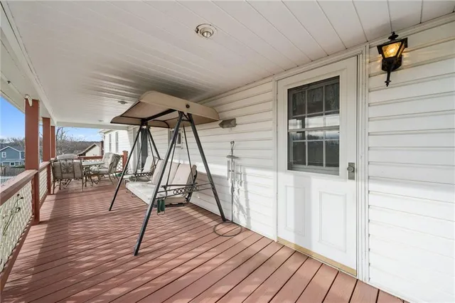 a balcony with furniture and city view