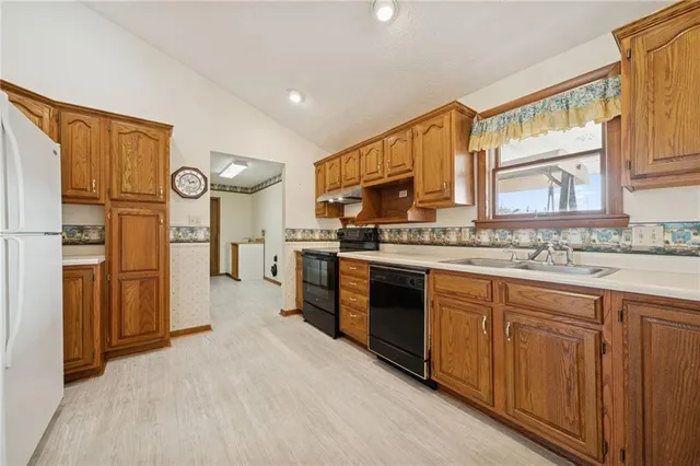 a view of a livingroom with a ceiling fan and window