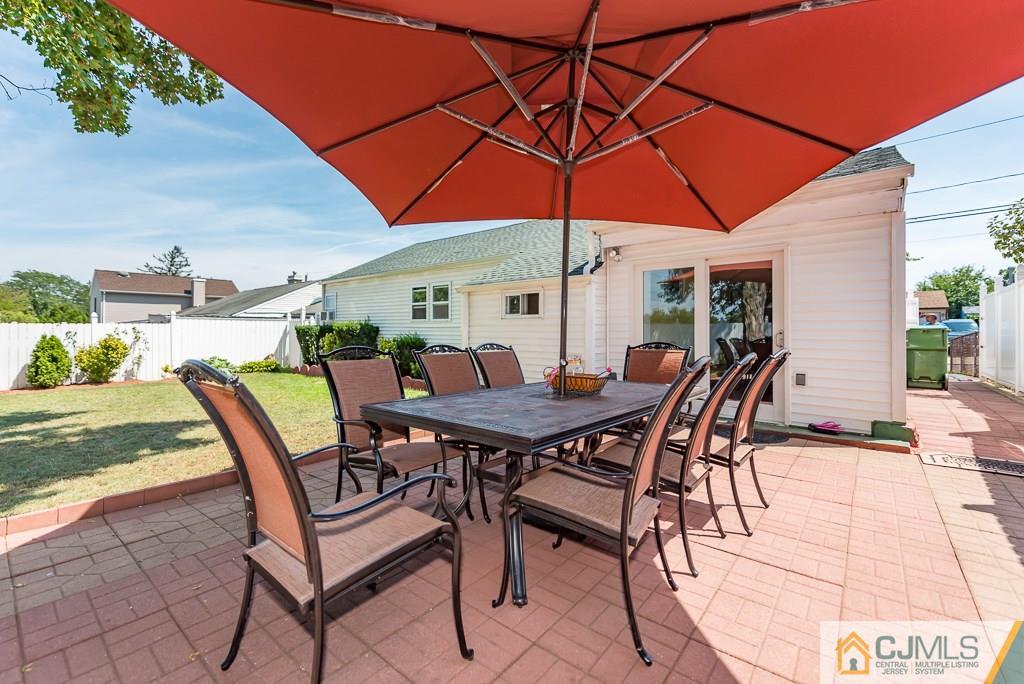 27 Winthrop Road Edison, NJ 08817 - Photo 22 of 25 a view of a backyard with furniture and a table