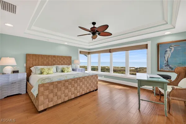 a bed room with a bed and a large window