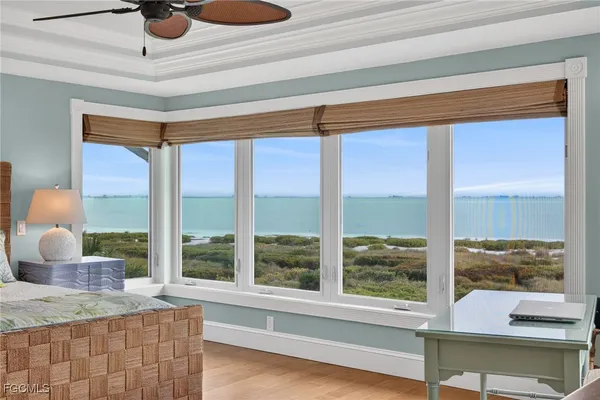 a very nice looking room with a large window and a chandelier