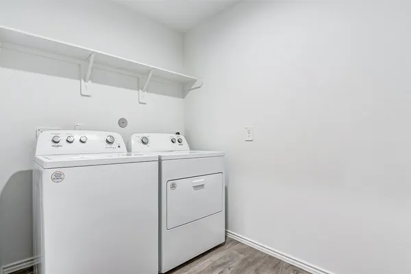 a utility room with dryer and washer
