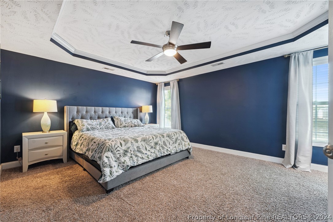 176 Vandercroft Way Bunnlevel, NC 28323 - Photo 19 of 36 a bedroom with a bed and window