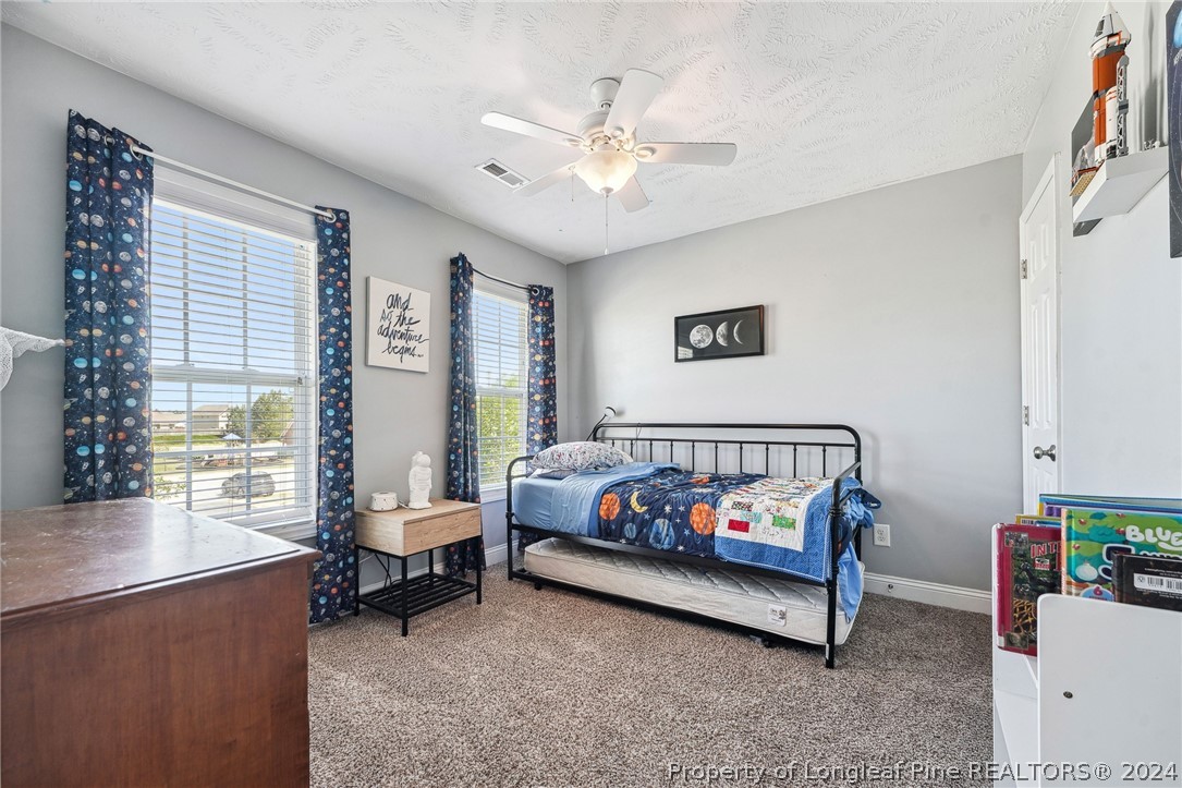 176 Vandercroft Way Bunnlevel, NC 28323 - Photo 26 of 36 a bedroom with a bed and a window