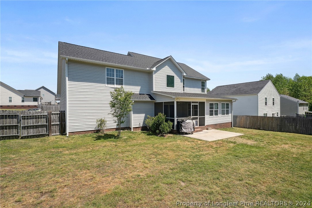 176 Vandercroft Way Bunnlevel, NC 28323 - Photo 32 of 36 a view of a house with a yard and sitting area
