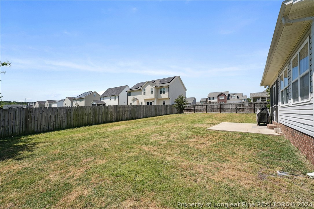 176 Vandercroft Way Bunnlevel, NC 28323 - Photo 35 of 36 a view of swimming pool with lawn chairs and large trees