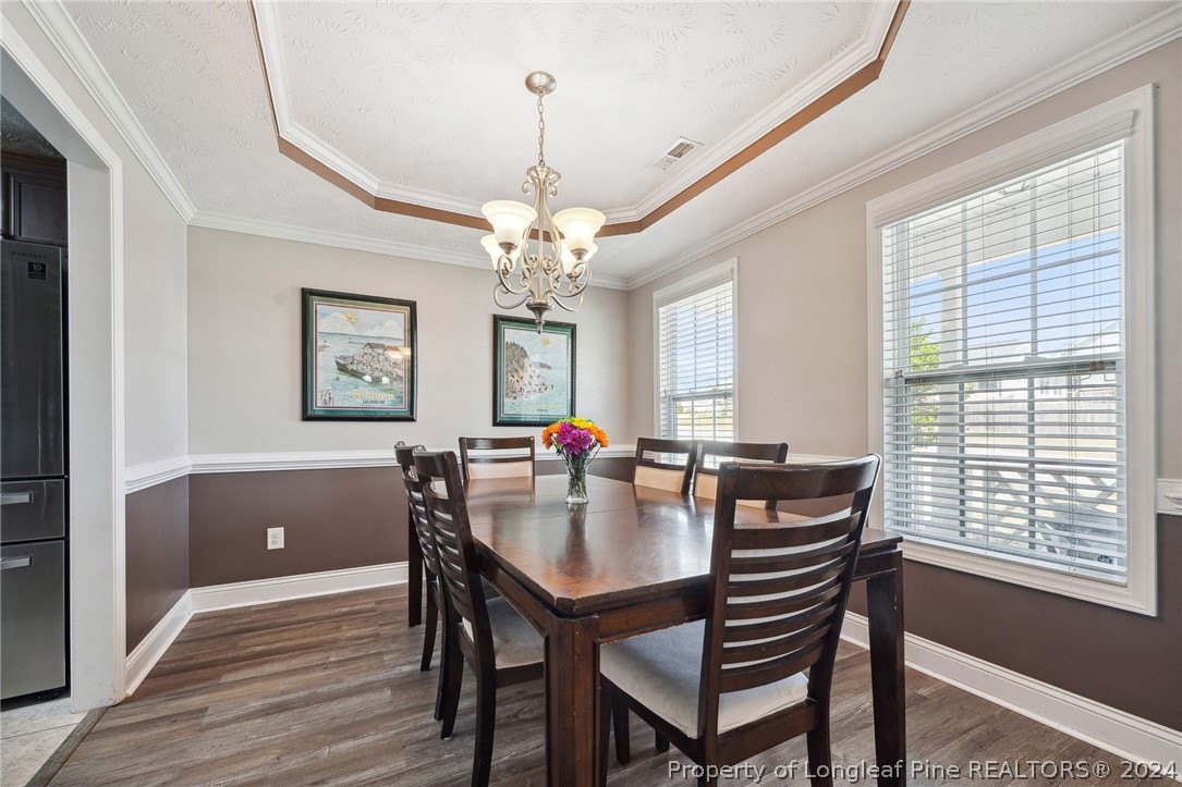176 Vandercroft Way Bunnlevel, NC 28323 - Photo 7 of 36 a view of a dining room with furniture and window