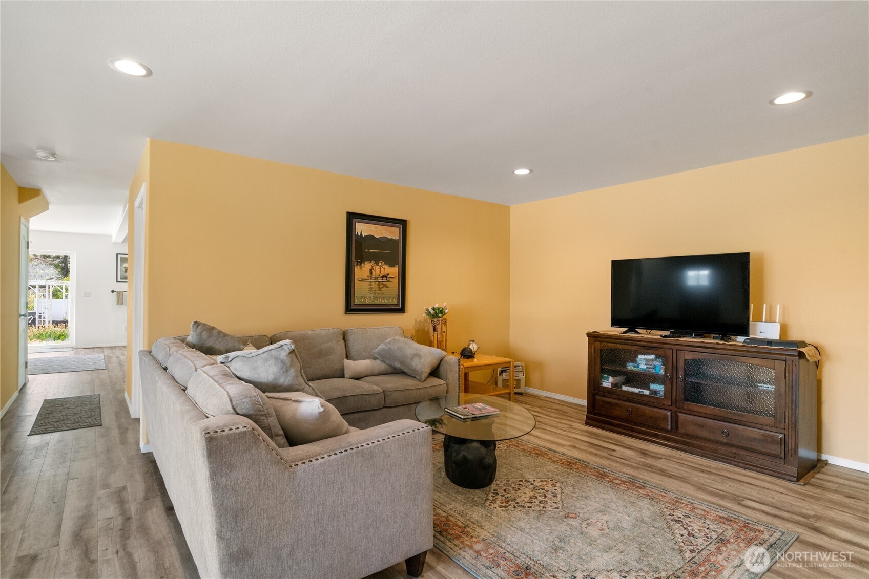 165 Granite Falls Road Chelan, WA 98816 - Photo 24 of 27 a living room with furniture and a flat screen tv