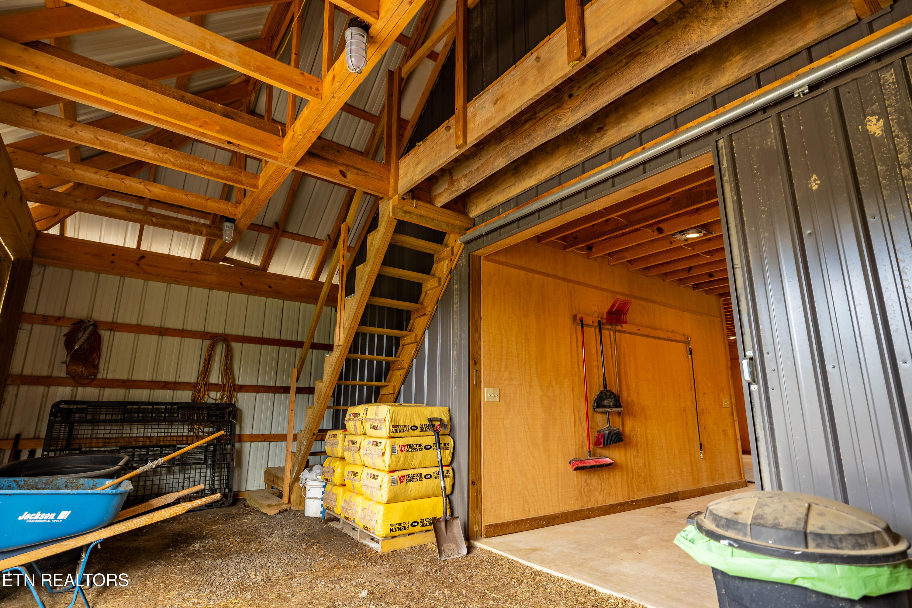 1152 Brier Branch Road Graysville, TN 37338 - Photo 36 of 49 Barn Utility Area & Stairs to hayloft