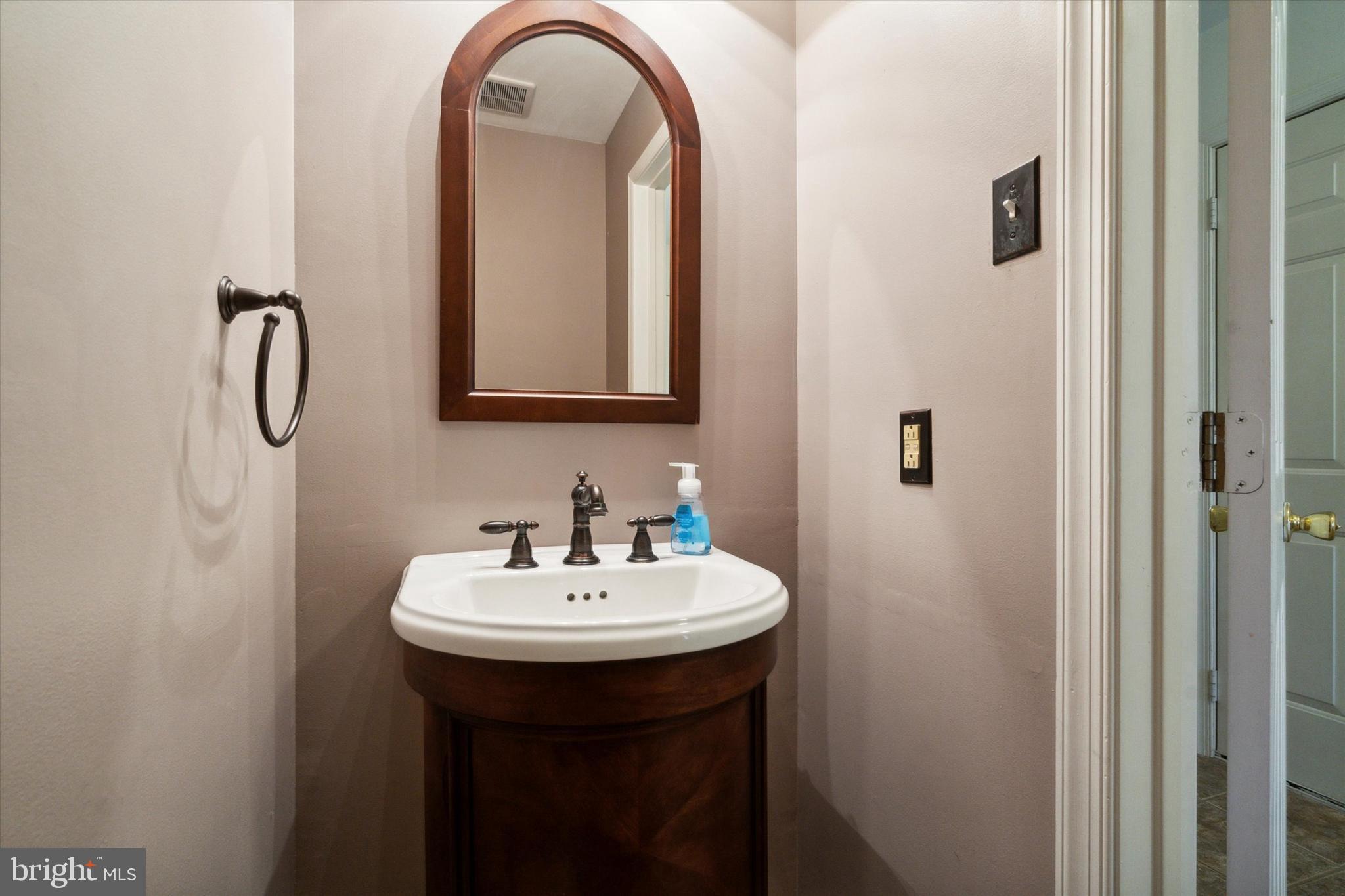 52 Piccadilly Circle Doylestown, PA 18901 - Photo 11 of 25 a bathroom with a sink and a mirror