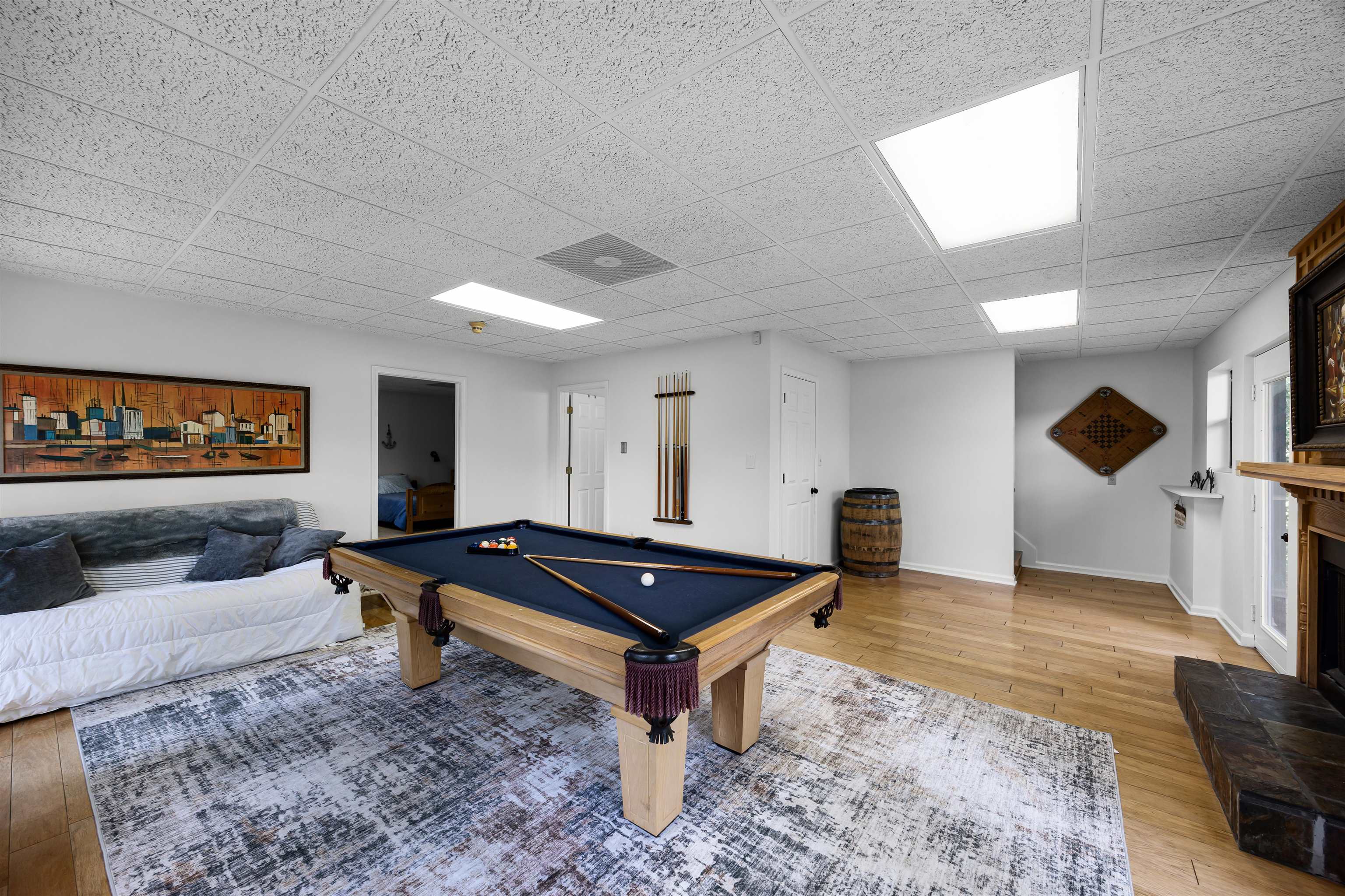 70 Point Clear Cove Savannah, TN 38372 - Photo 11 of 26 Game room with light wood-style floors, billiards, a paneled ceiling, and a fireplace with raised hearth