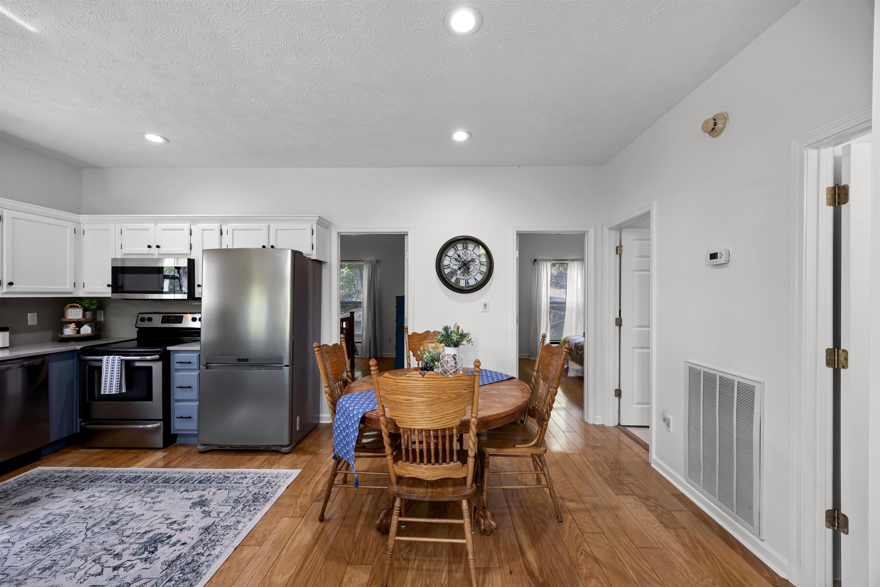 70 Point Clear Cove Savannah, TN 38372 - Photo 18 of 26 Dining space with light wood-type flooring, a textured ceiling, and recessed lighting