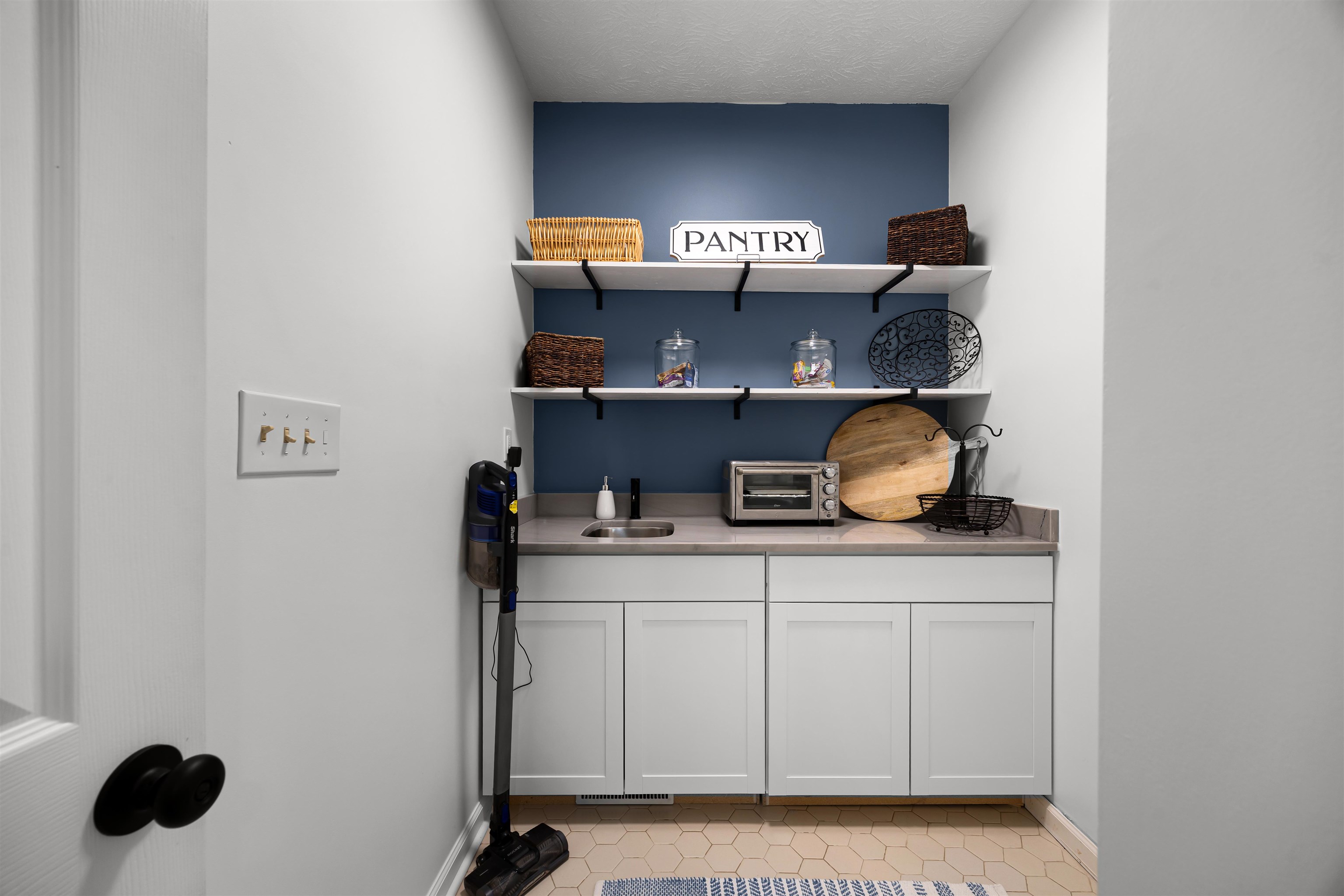 70 Point Clear Cove Savannah, TN 38372 - Photo 21 of 26 Pantry with Loads of storage, open shelves, and Quartzite countertops