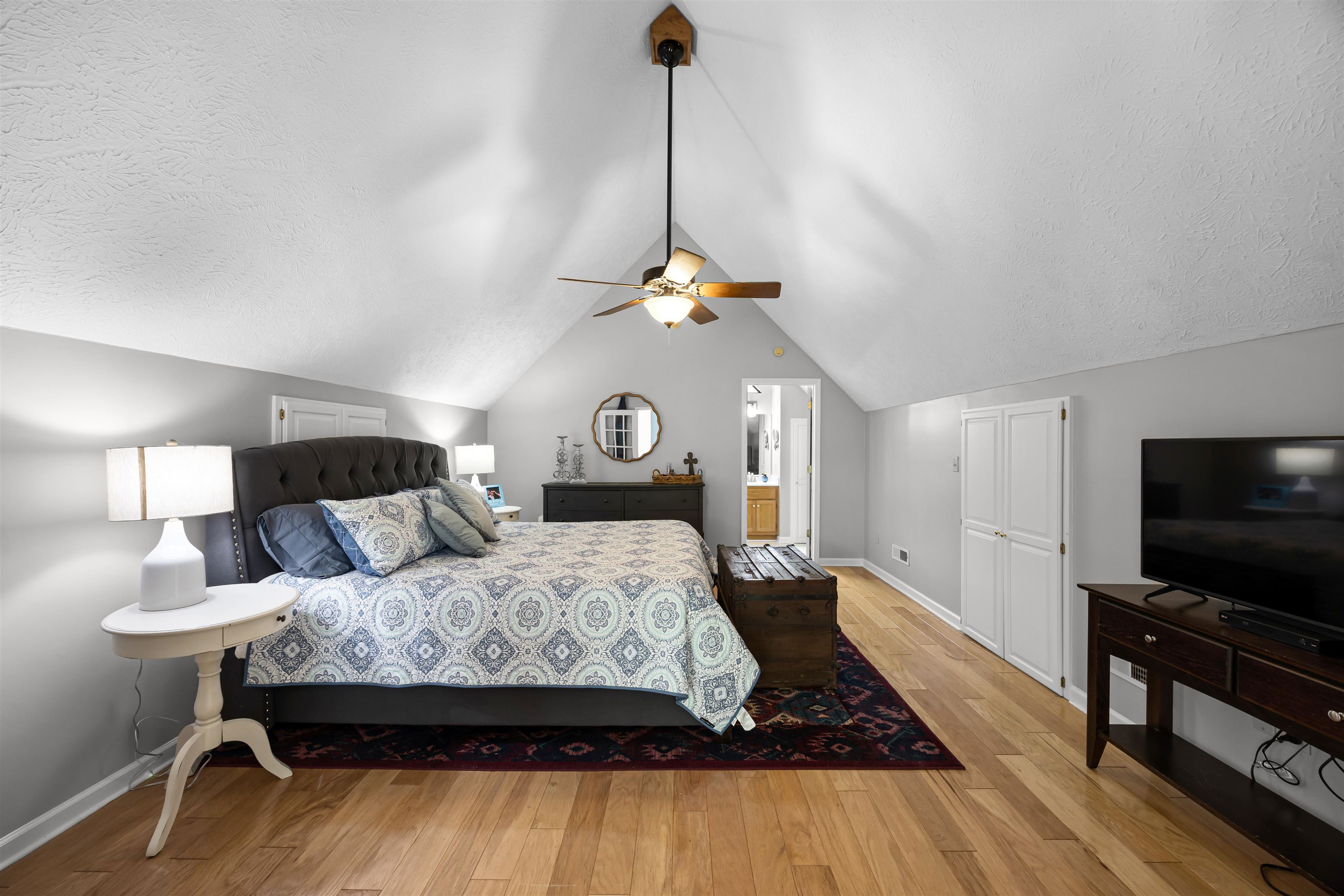 70 Point Clear Cove Savannah, TN 38372 - Photo 23 of 25 Bedroom with light wood-type flooring, vaulted ceiling, a ceiling fan