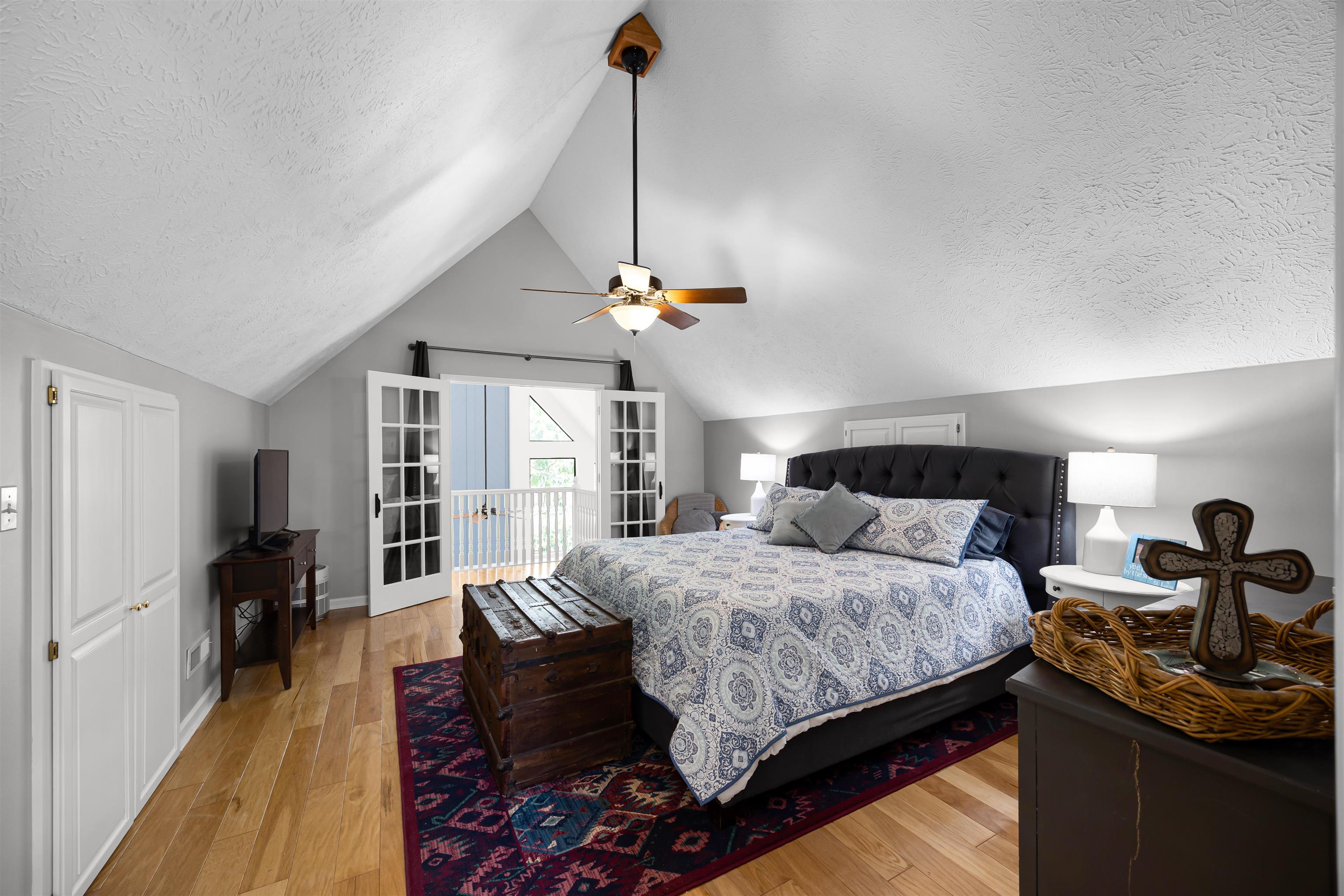 70 Point Clear Cove Savannah, TN 38372 - Photo 25 of 26 Bedroom with a light wood finished floors, vaulted ceiling, a ceiling fan