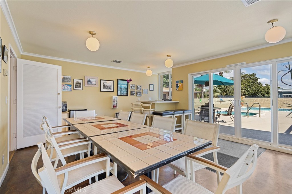 1 3rd Place, Unit 2 Long Beach, CA 90802 - Photo 23 of 55 a view of a dining room with furniture wooden floor and chandelier